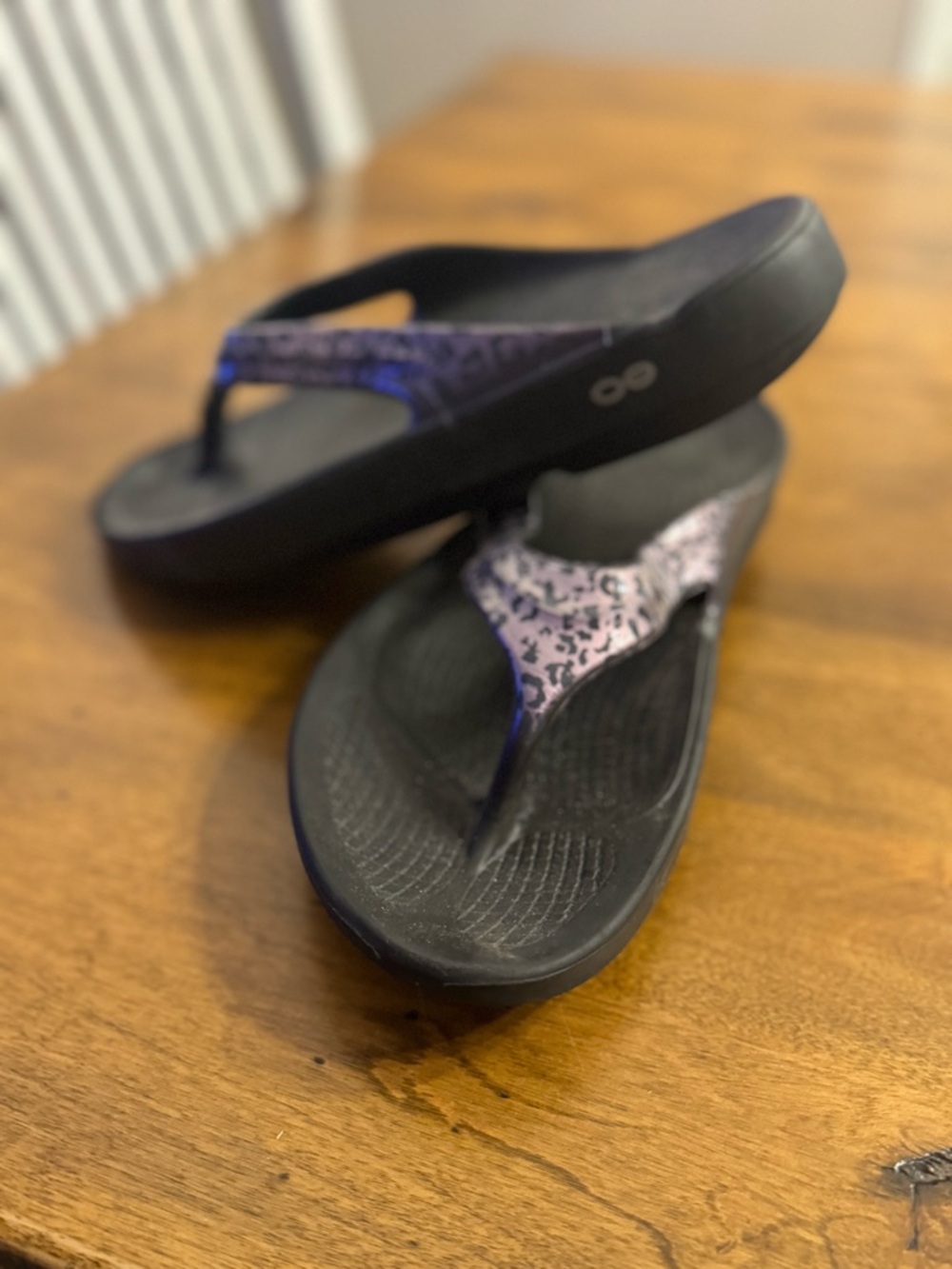 OOFOS Black Flip Flops with Purple Patterned Straps